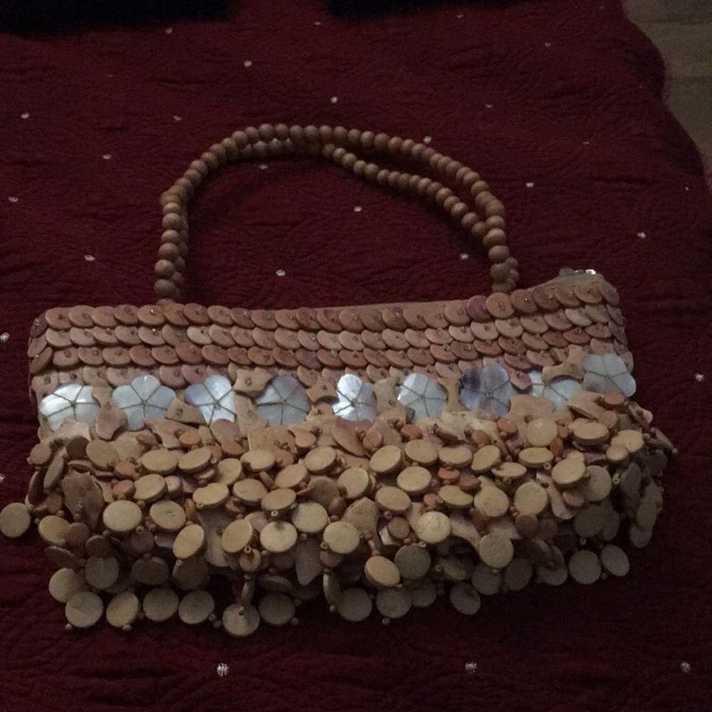 Mido Collection purse, coconut shells and Mother of pearl accent in front